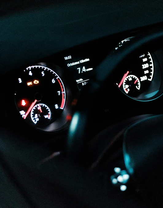 car dashboard displaying oil warning light indicating engine problem